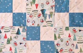 Quilt in Christmas fabrics