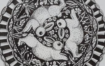 A circular sketch (Mandala) of some rabbits surrounded by intricate nature-related detailing