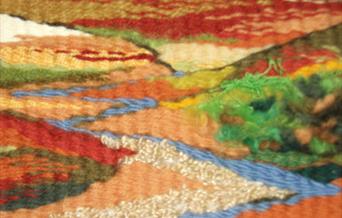 Tapestry weaving in bright colours