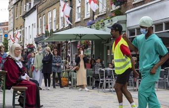 Two dancers dancing on Church Street.