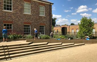 People working in the gardens of Orleans House Gallery