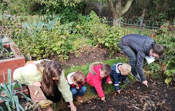Children and adults at a community growing session
