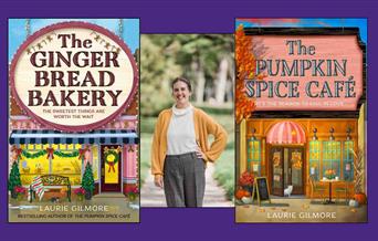 "Author Laurie Gilmore stands outdoors  flanked by her book covers: 'The Ginger Bread Bakery' on the left and 'The Pumpkin Spice Café' on the right."