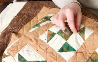 A women quilting