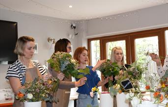 a group attending a floristry workshop