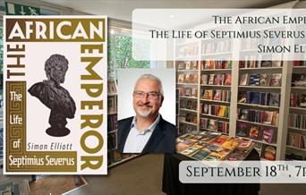 Picture of historian Simon Elliott next to his new book The African Emperor with date September 18th 7pm behind backdrop of Books on the Rise