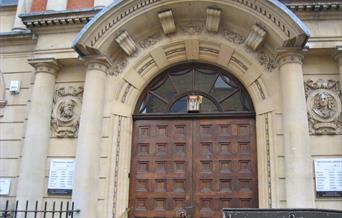 Tennyson and Pope carvings on Twickenham Library entrance