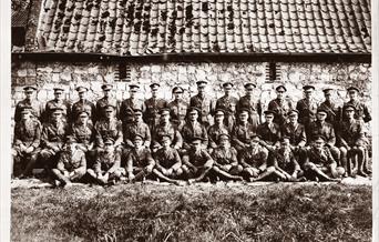Men in uniform gathered for a photograph