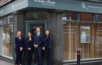 White Rose Modern Funerals Exterior with Team Smiling Outside