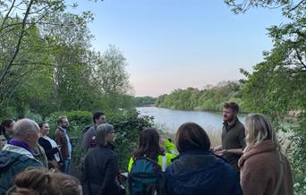 A group of people at a bat walk