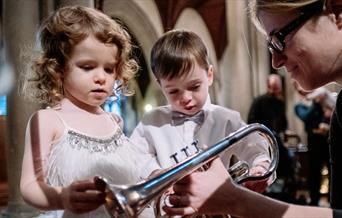 children examining trumpet at bach to baby concert