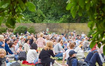 Families enjoying outdoor theatre