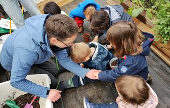 Children and adults at a community growing session
