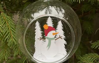 Glass bauble with papercut Santa