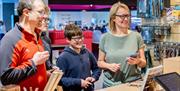 Family paying in National Archives gift shop