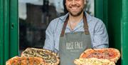 Base Face Pizza, Worker Hold Four Pizzas
