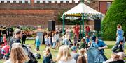 Hampton Court Food Festival - Music performance in Hampton Court Palace with people watching