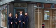 White Rose Modern Funerals Exterior with Team Smiling Outside