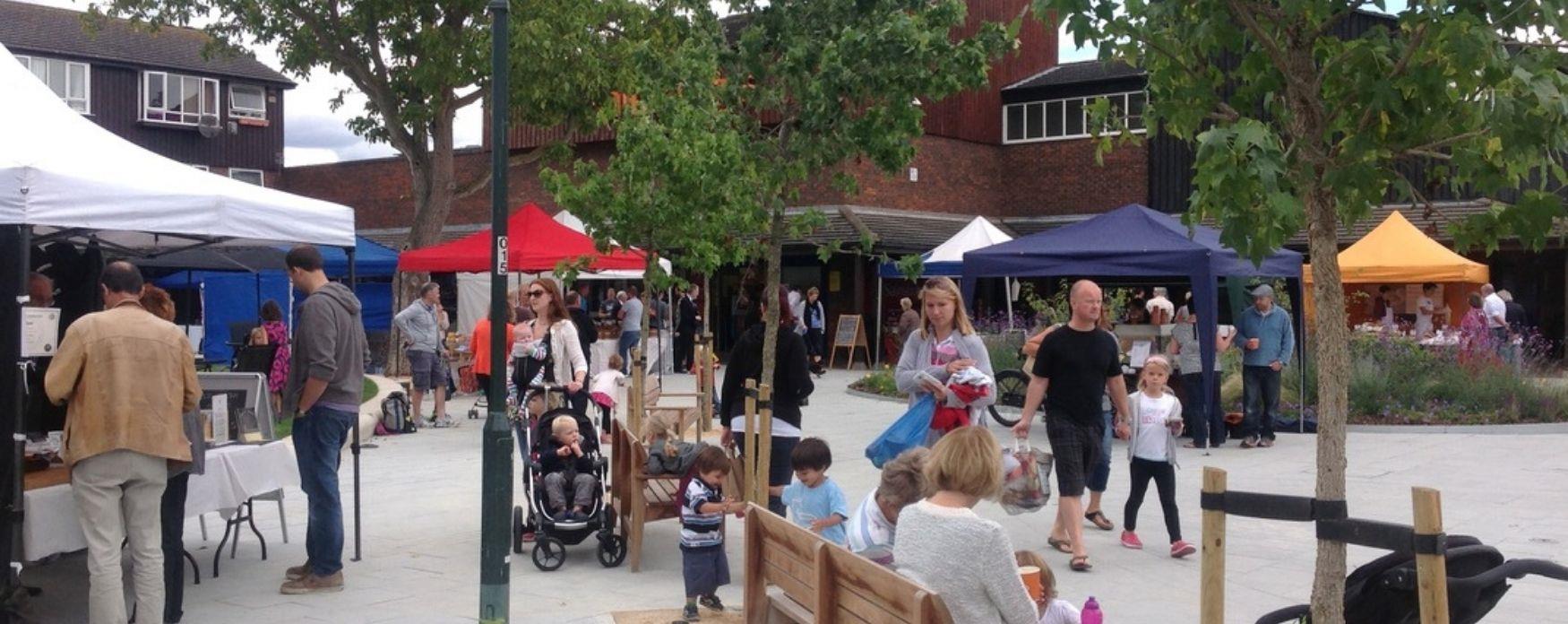A picture of local residents enjoying local food from Hampton market
