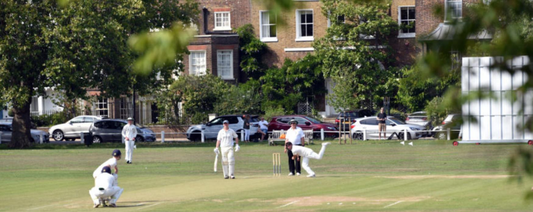 Playing cricket at Kew Green