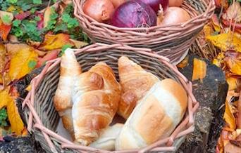 Handmade basket with breads and onions