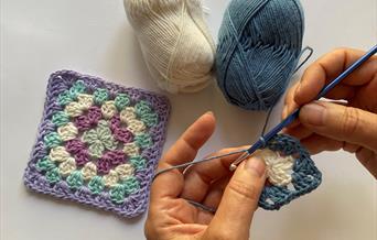 Granny squares being crocheted