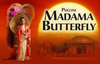 Poster for Ellen Kent's production of Puccini's Madama Butterfly. Behind the title a sun is setting against a red background, and below is a tradition