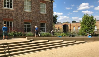 People working in the gardens of Orleans House Gallery