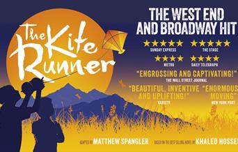 Poster for The Kite Runner. The silhouettes of two children stand against a landscape of gold long grass and blue mountains; a golden sun sets behind