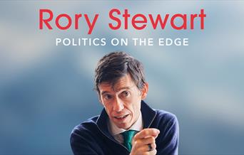 Poster for 'Rory Stewart - Politics on the Edge'. Rory is visible from the chest up, looking off camera and pointing as he speaks. He is against a blu