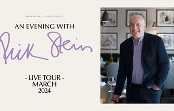 Artwork for 'An Evening with Rick Stein'. Rick stands in his restaurant, leaning slightly against the table to the left