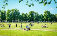 An image of Richmond Green and kids playing games while adults enjoying the weather