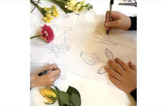 Children drawing various flowers