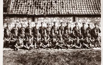 A group of uniformed men posing for a photo.