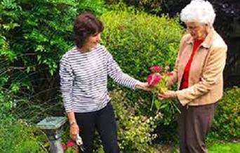 Gardening in the gardens at CrossRoads Care.