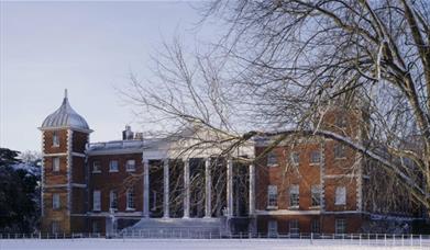 East front of Osterley Park, Middlesex, with snow covering the ground and a tree in the foreground