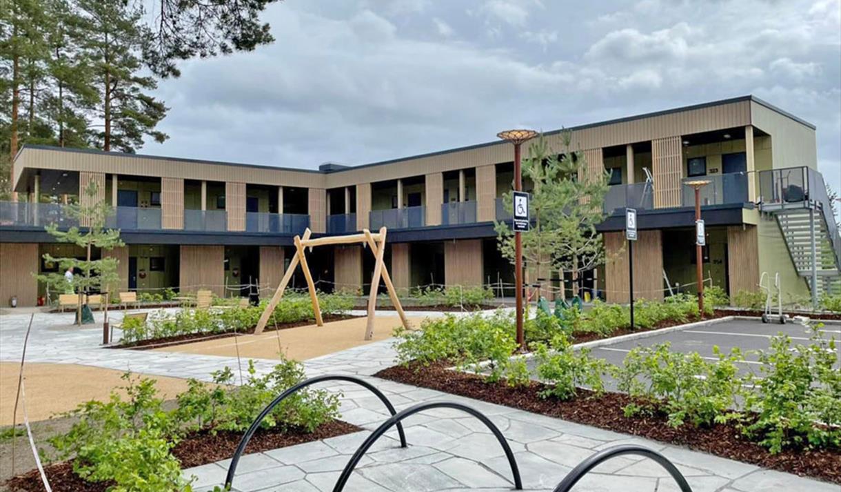 The newly built Hotell fritidsparken from the outside with a playground