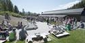 People at the canal park at Vest-Telemark Museum Eidsborg.