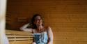 lady in the sauna at Skogen's room