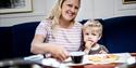 mother and son enjoying waffles in the restaurant on MS Fram