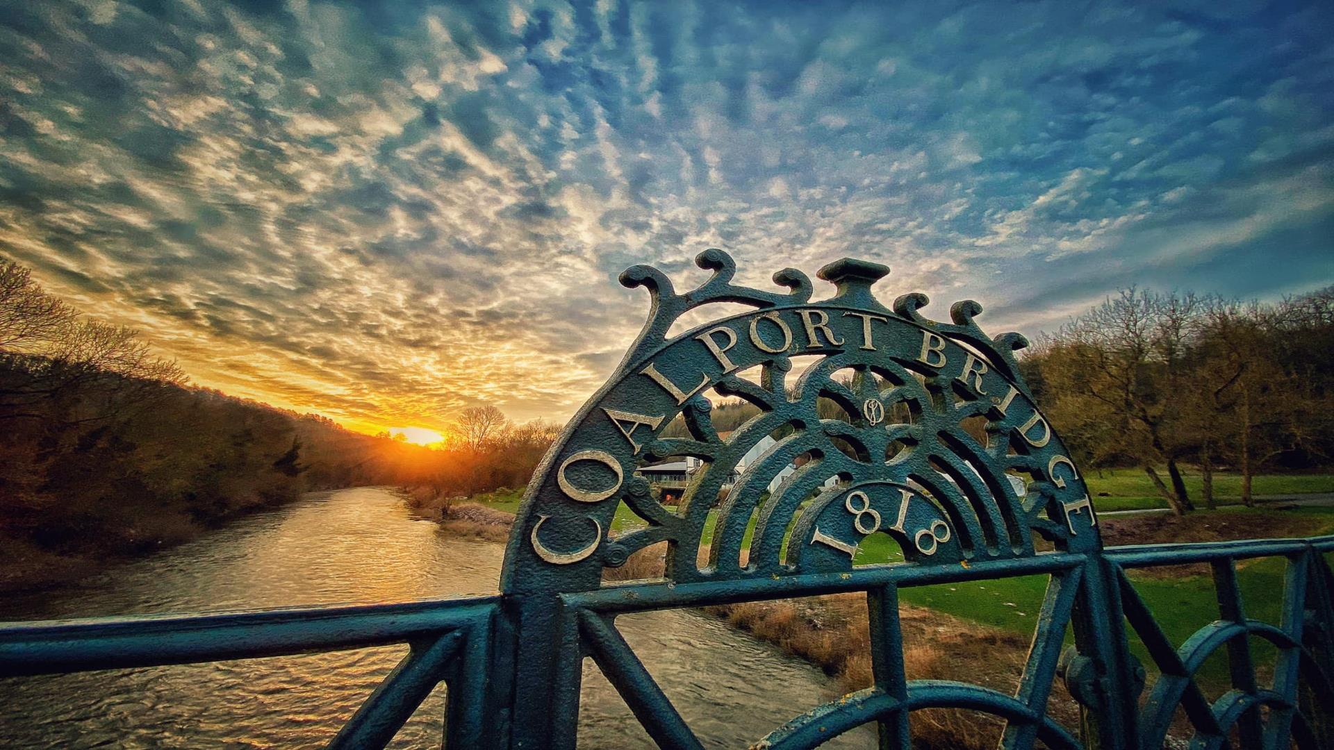 Sunset and country park sign