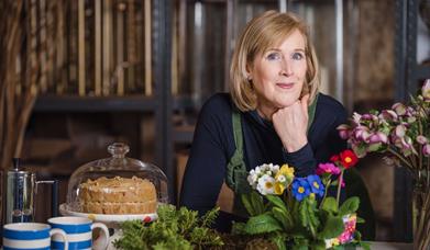 lady with flowers and cake