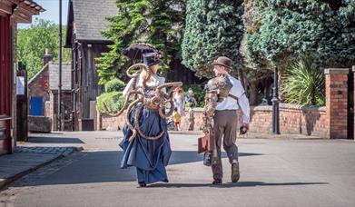 Steampunk festival attendees at Blists Hill Victorian Town wearing steampunk costumes