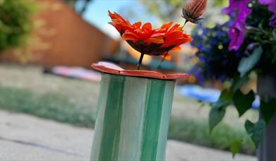 Hand-buillt and decorate a ceramic vase and flower frog