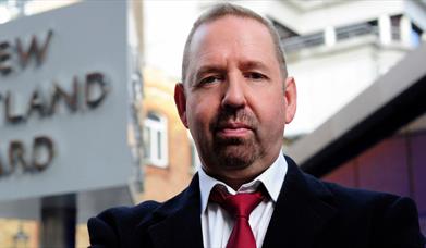 A photo of Alfie Moore outside Scotland Yard
