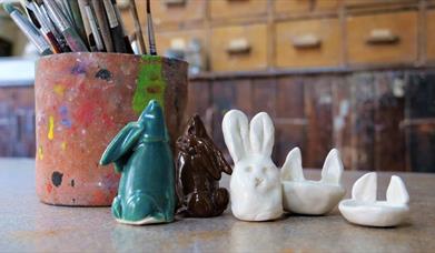 Ceramic bunny creations displayed on a table