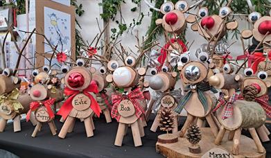 Christmas market stalls pictured with their wares.