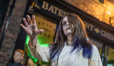 A photo of a demonstrator dressed as a ghost.