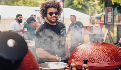 Adam Purnell pictured cooking over fire