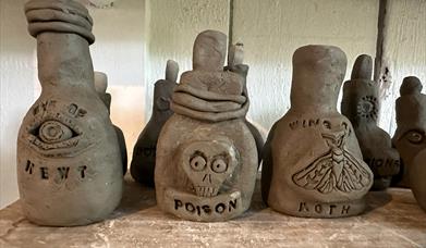 A photo of Clay pots made by children.